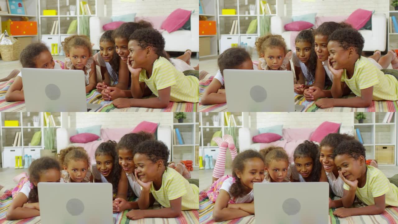 黑人孩子在笔记本电脑上观看视频