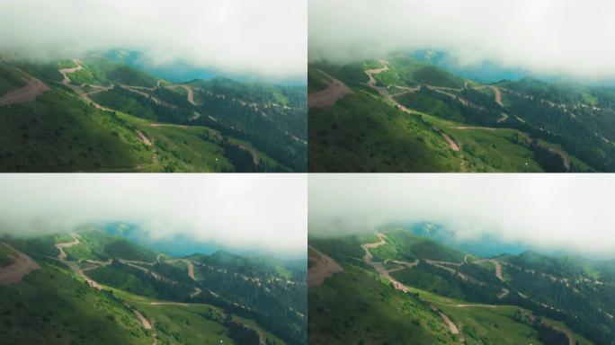 空中4k视图。飞过山顶上的云层。高峰美妙的早晨日出自然景观。