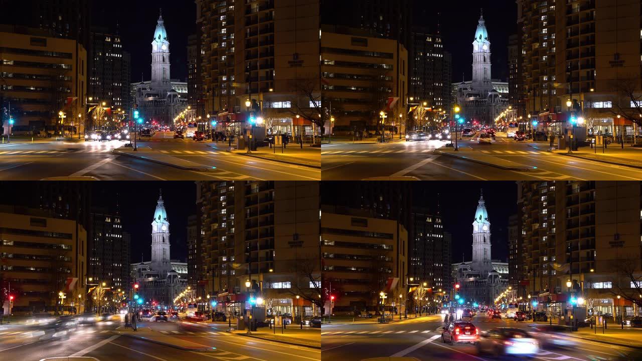 夜间延时: 费城市政厅沿本杰明·富兰克林·Pkwy，夜间在美国宾夕法尼亚州市中心的城市中心天际线摩天