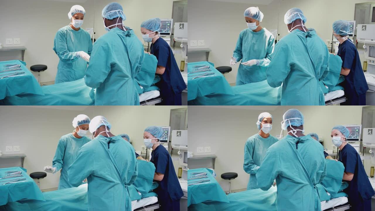 护士用外科医生的医疗器械作为手术团队在手术室对患者进行工作