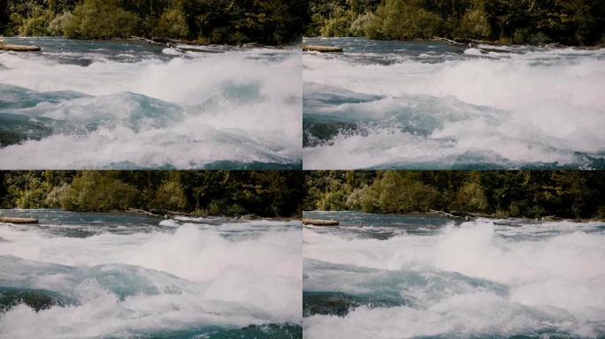 美丽的特写镜头，泡沫在猛烈的尼亚加拉和岸上的绿树汹涌的快速河流急流上飞溅。