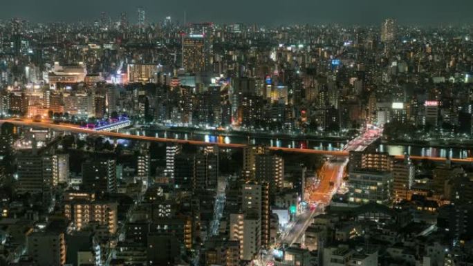 从日本东京晴空塔出发，在夜间高峰时段，东京城市景观的4k时间流逝与各种建筑摩天大楼和交通道路交叉路口