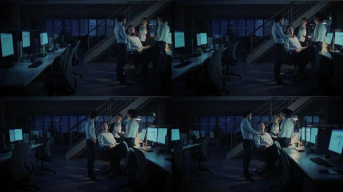 深夜在现代办公室: 由成功且雄心勃勃的商人和女商人组成的多元化团队在计算机上工作，进行讨论，寻找问题