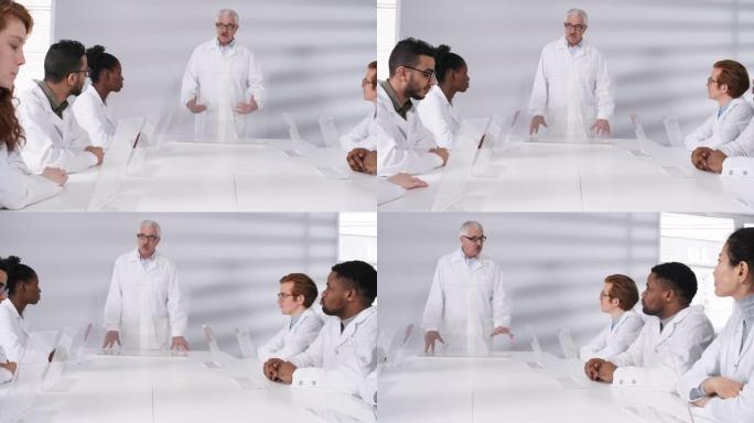 带AR设备的研究生小组在会议上听资深教授