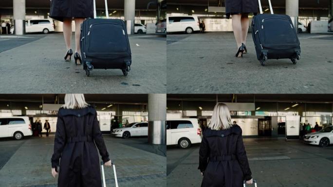 CU到MS女商人带着手提箱在机场外散步