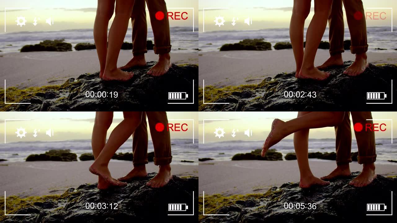 用数码相机4k在海滩上拍摄一对夫妇
