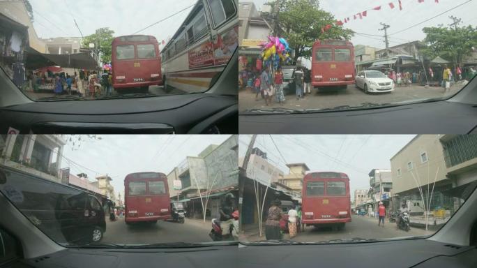 斯里兰卡繁华街道上的MS Car跟随公交车