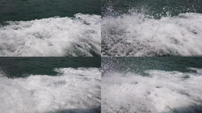 在海浪撞击船之间的公海中，全速行驶的船的镜头