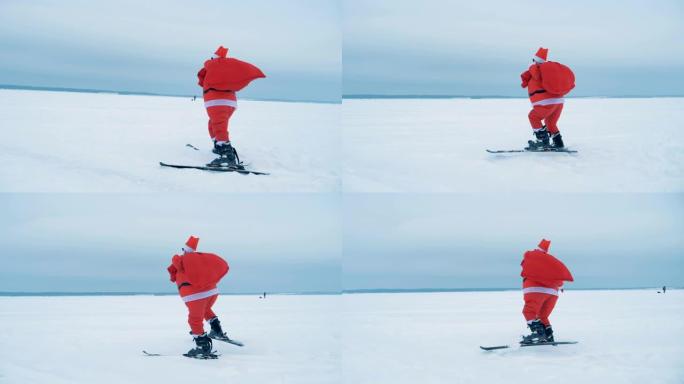 一个圣诞老人在滑雪时拿着一个装有礼物的麻袋，侧视图。