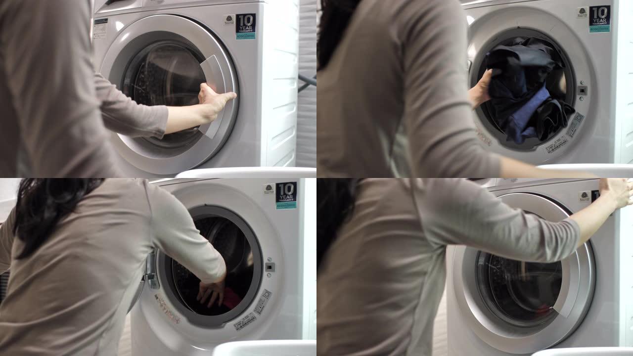 洗衣机上的洗衣房把脏衣服放进洗衣机机器洗
