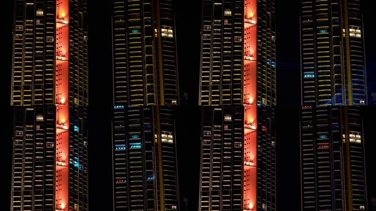 4k镜头的场景，在夜间以bokeh背景呈现城市闪烁的灯光，以新年快乐和派对概念庆祝