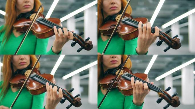女人在女性手中演奏小提琴的特写镜头