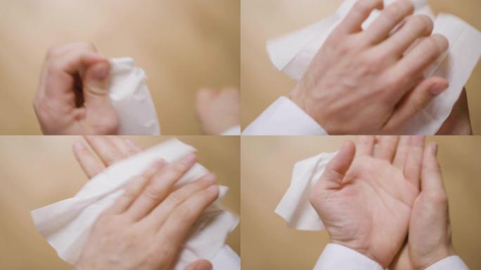 男子用消毒湿巾清洁双手