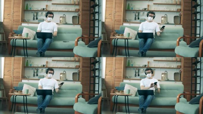 检疫期间，戴医用口罩的人在家工作。