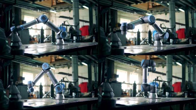 机器人在工厂的桌子上使用齿轮工作。