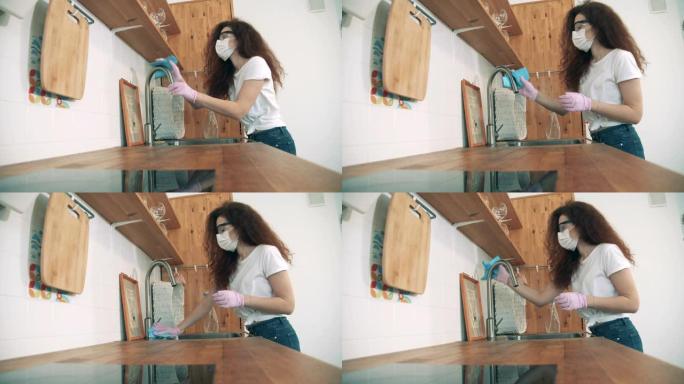 女孩在冠状病毒大流行期间打扫厨房。