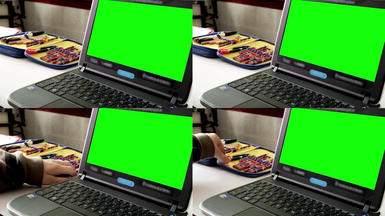 绿屏笔记本电脑。