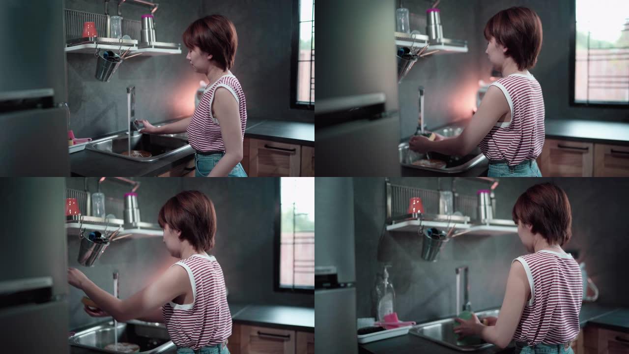 女人在家用海绵洗碗
