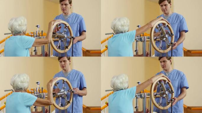 老年妇女在理疗机上锻炼手臂