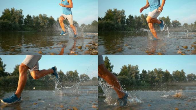 低角度: 快乐的年轻人在河里奔跑，溅起清爽的水。