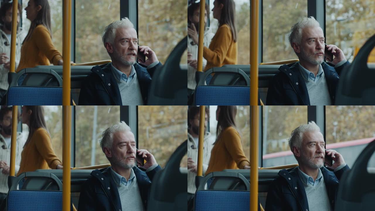 成熟的男人在公共汽车上打电话