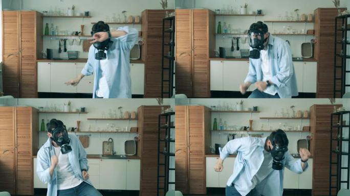 新型冠状病毒肺炎冠状病毒大流行期间，一名戴着危险品面具的男子正在家里跳舞。