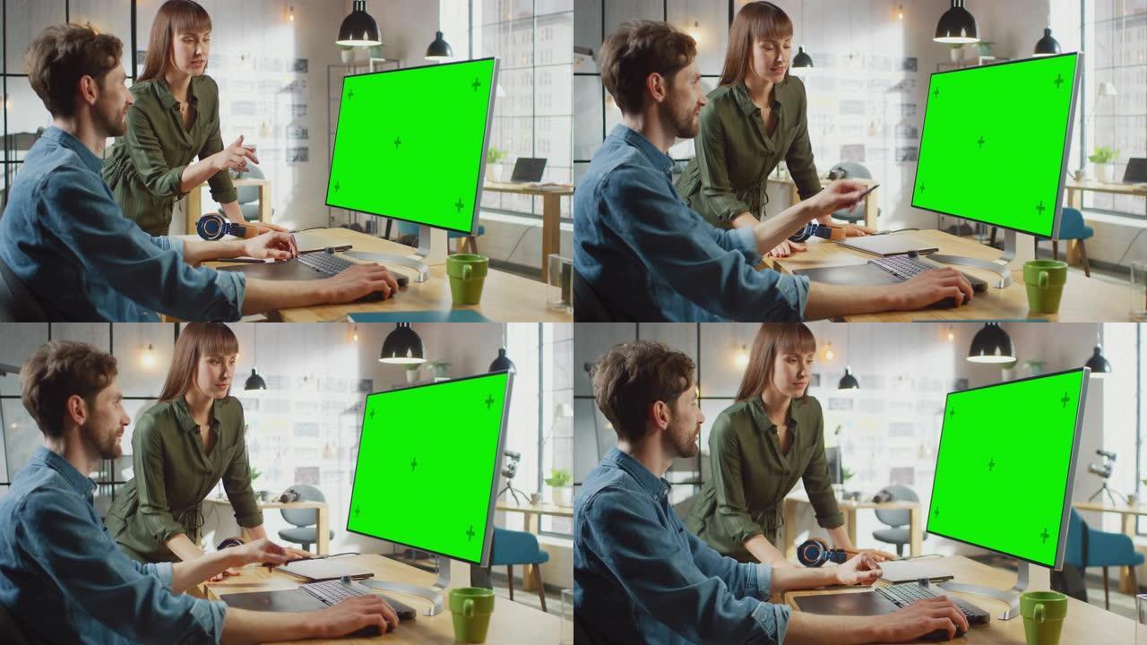 女艺术总监咨询设计师同事，他们在带有绿屏模拟显示的个人计算机上工作。他们在凉爽的办公室阁楼里工作。它