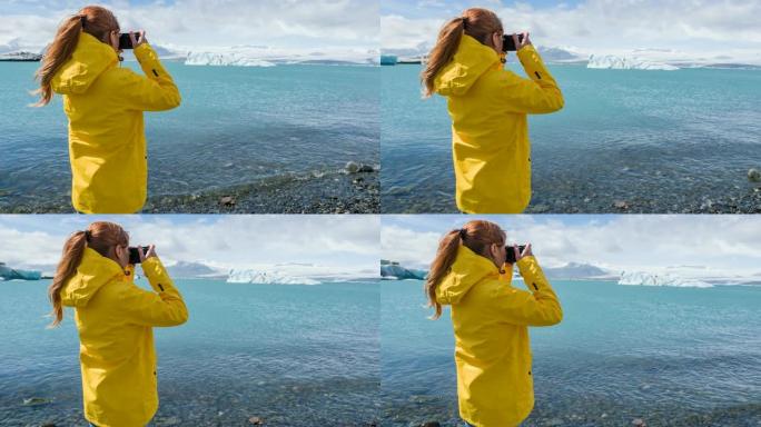 冰岛钻石海滩上的女游客Breidamerkursandur，拍摄从Jokulsarlon冰川泻湖漂浮