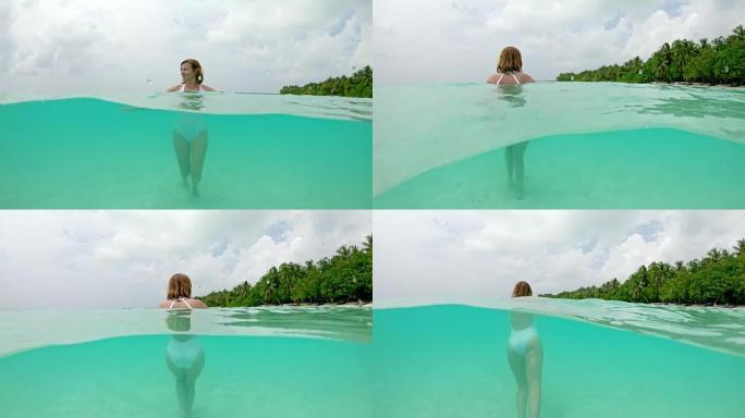 女士在马尔代夫热带海洋游泳