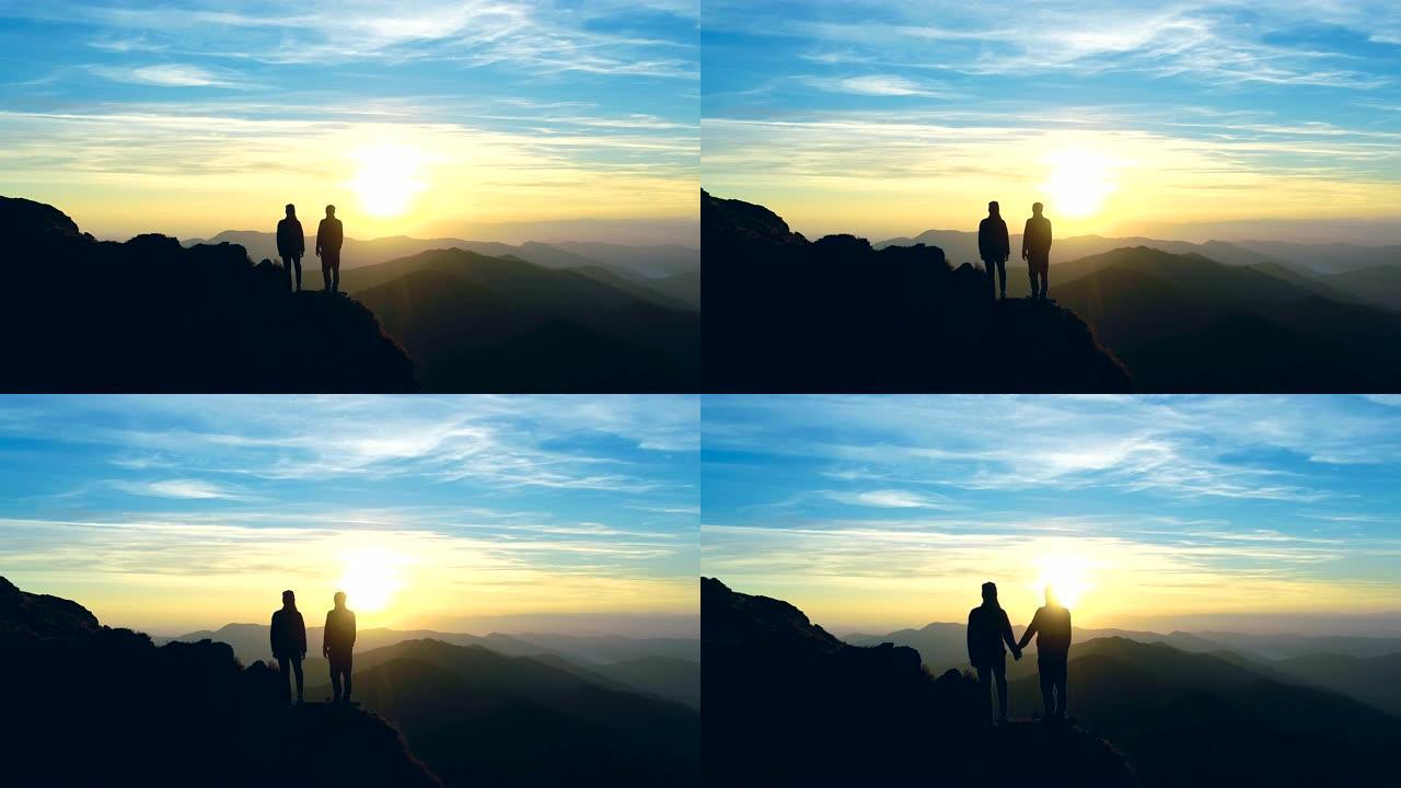山上的男人和女人看着美丽的风景