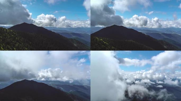 风景如画的群山上空的云层飞行。过度下垂