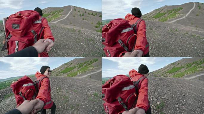 女人在山里和男朋友徒步旅行的视点