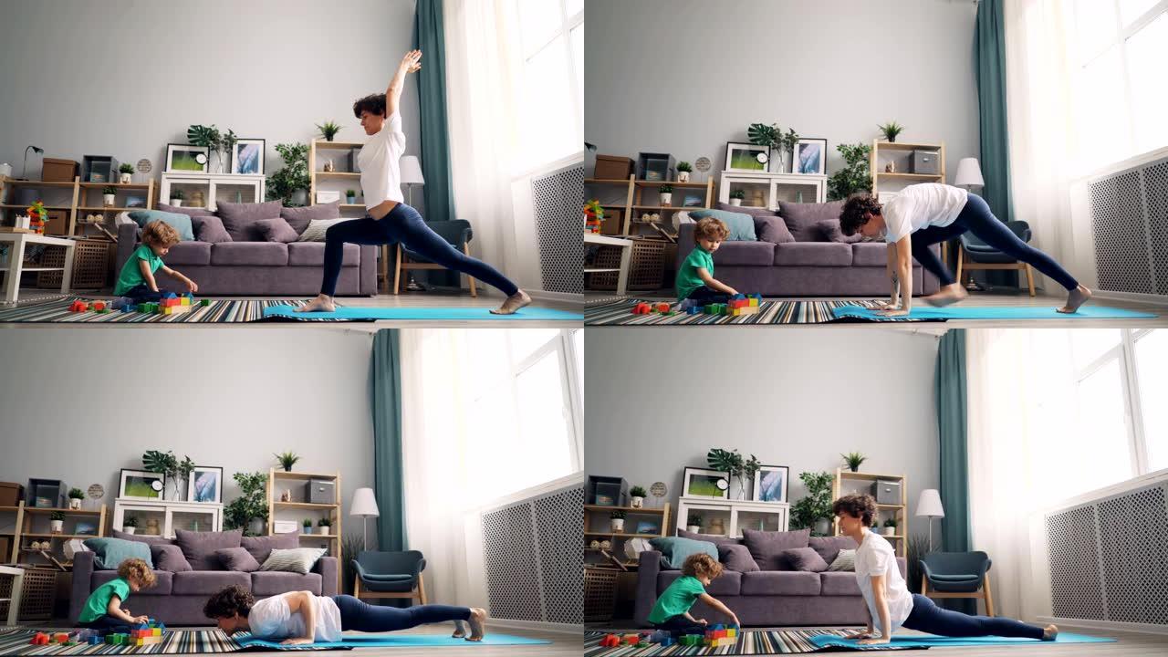 现代家庭主妇在做瑜伽，而她的小孩在地毯上玩积木