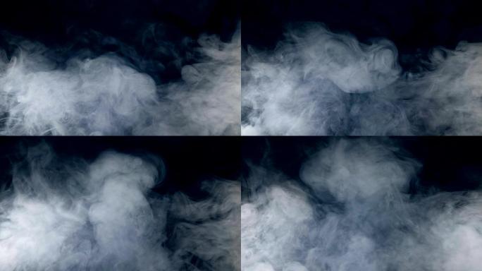 黑暗的背景和流动的雾状漩涡。雾，烟，云隔离在黑色背景上。