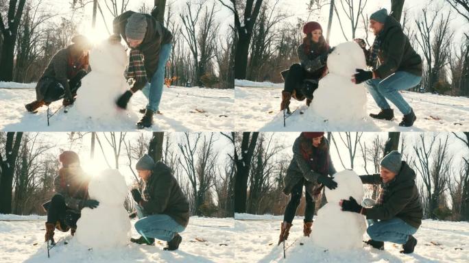 幸福的夫妇堆雪人。