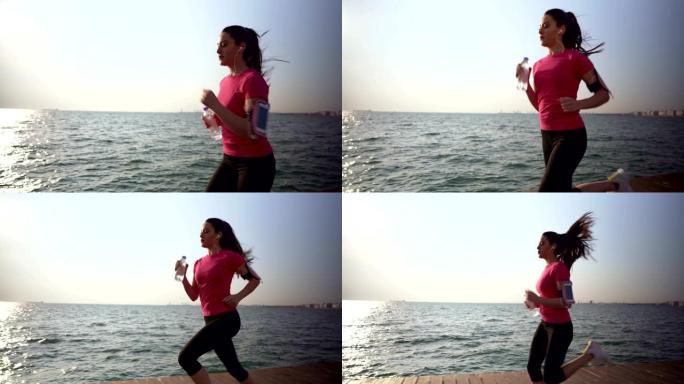 女人在海边慢跑有氧运动海边跑步运动奔跑