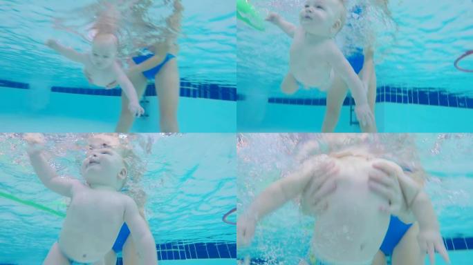 可爱的宝宝试图在水下游泳，特写。