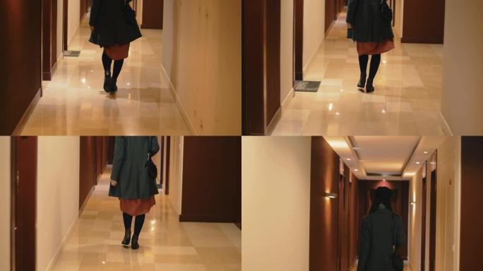 年轻的高加索女商人沿着酒店走廊走廊走到她的数字慢动作的电影后视镜头