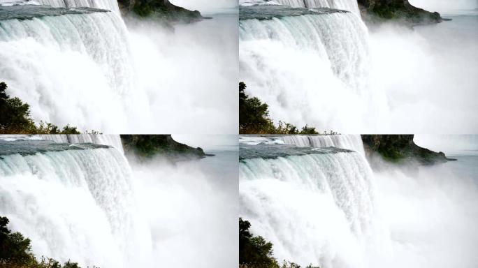 史诗般的特写镜头，强烈的汹涌水流和喷雾在美丽的尼亚加拉瀑布慢动作中冲下。