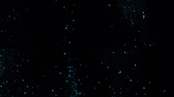 超级SLO MO蓝色闪光落在黑色背景上