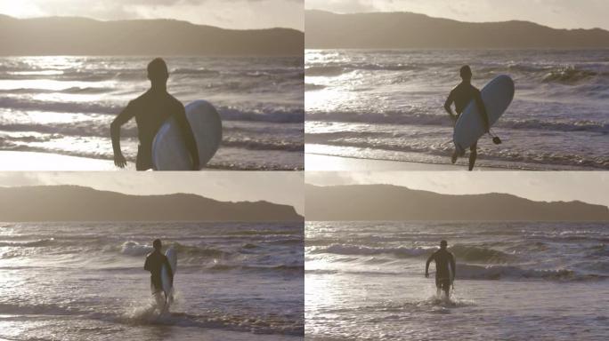 又一天冲浪拿着冲浪板跑向海边视频素材