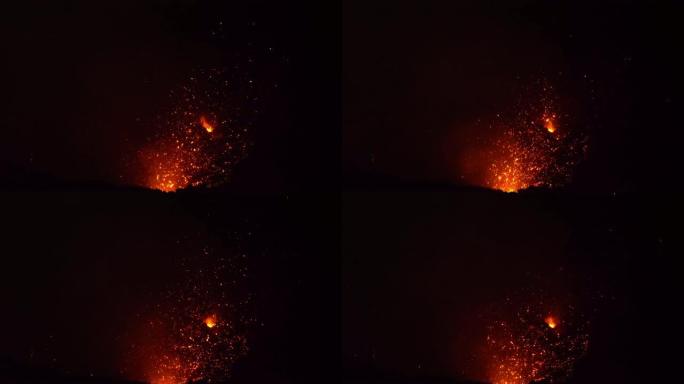 特写: 从Yasur山深处爆炸的熔岩照亮了火山口。