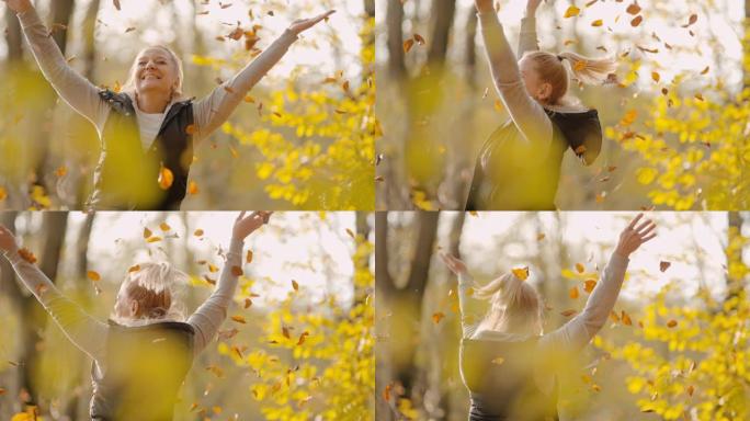 MS超级慢动作顽皮的年轻女子在森林中扔金色的秋叶