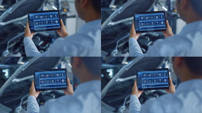 汽车服务经理或机械师使用带有未来派交互式诊断软件的平板电脑。专家检查车辆，以便在发动机舱中发现损坏的