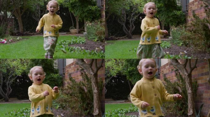 在花园里奔跑的高加索婴儿