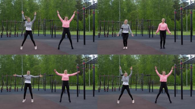 高加索双胞胎姐妹在健身体育场做跳跃动作