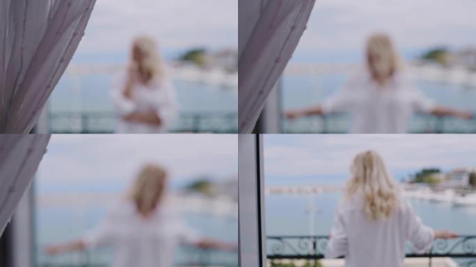 穿着白衬衫的WS女人在海边的阳台上欣赏风景