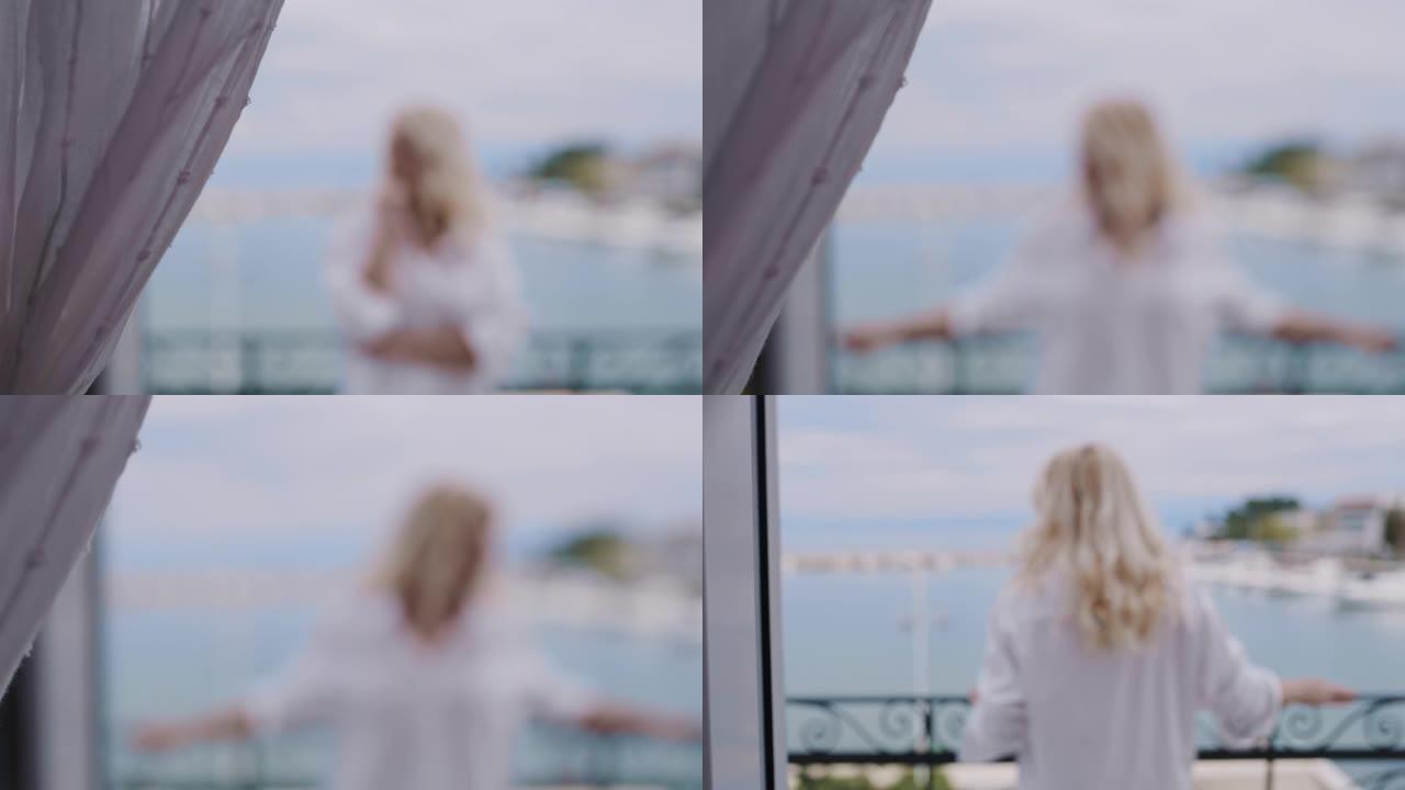穿着白衬衫的WS女人在海边的阳台上欣赏风景