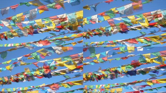 特写: 在阳光明媚的日子里，充满活力的旗帜在西藏上空挥舞的电影镜头