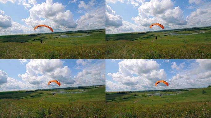 天空中的滑翔伞活动。驾驶副飞机的人的自然景观。